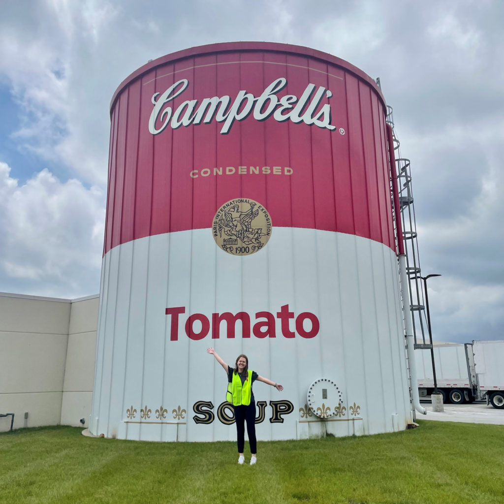woman in front of soup can silo