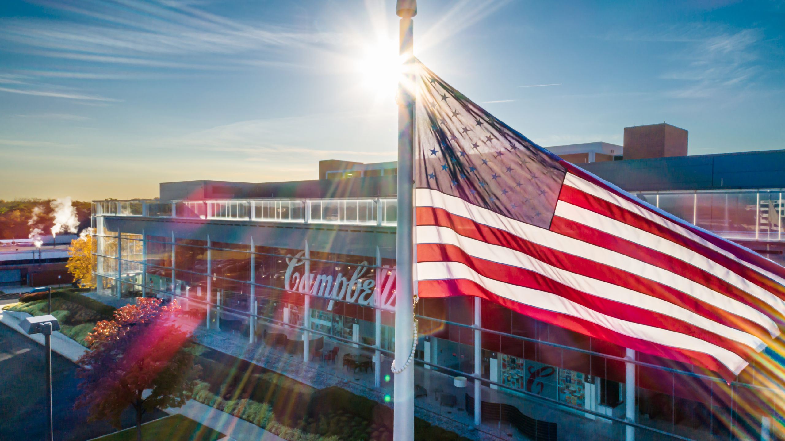 american flag in front of campbell soup company headquarters in camden, new jersey