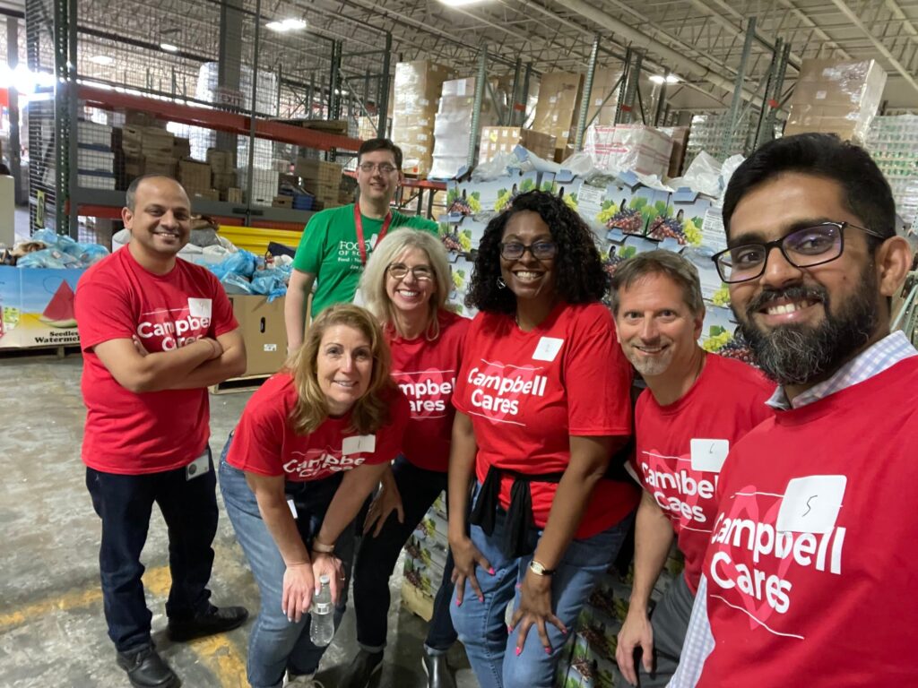 Selfie with employees at food bank